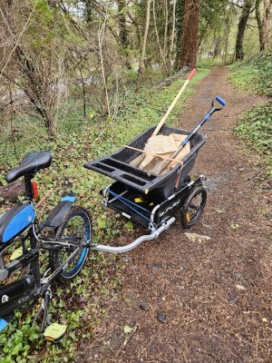 my propella mini (weighs 38lbs?) hauling with burley trailer (also has a front rack)